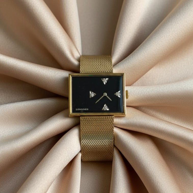 Longines watch on beige satin