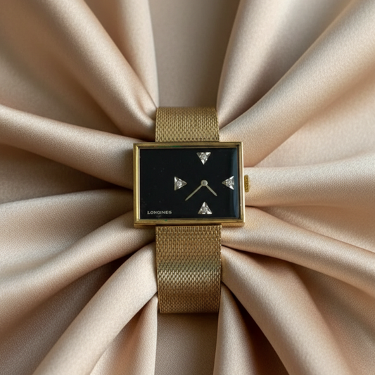 Longines watch on beige satin